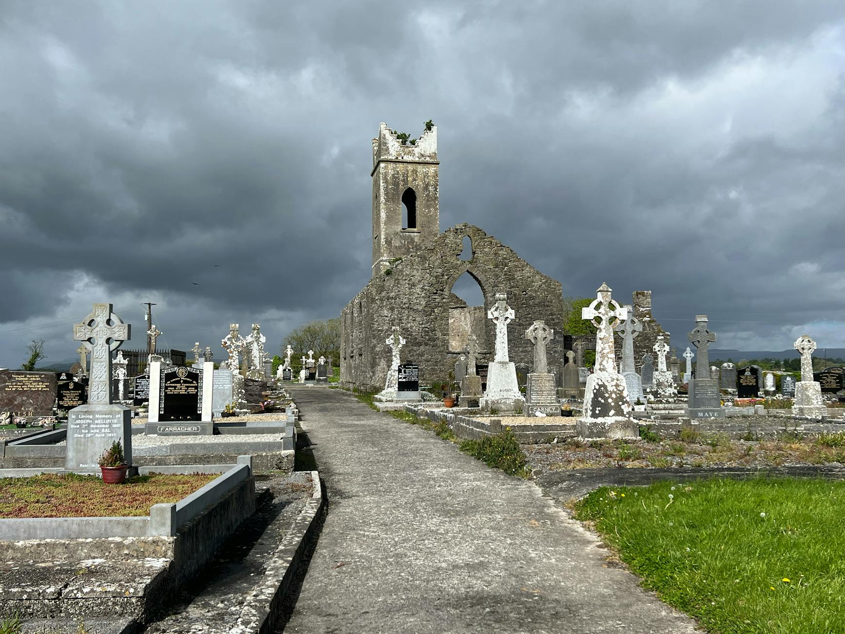 clouds over graveyard and church ruins